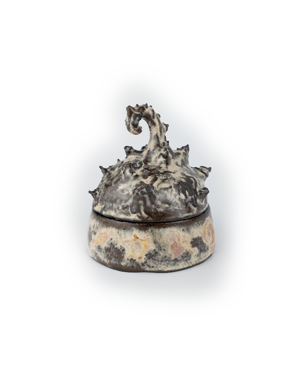 Decorative ceramic jar with a creature-like design