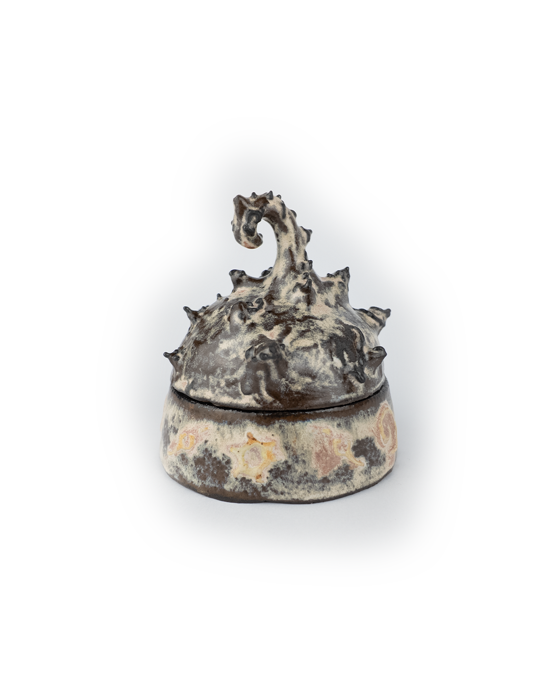 Decorative ceramic jar with a creature-like design