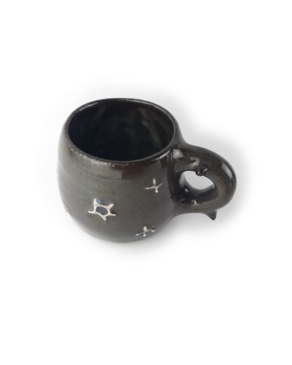 Black ceramic mug with star designs